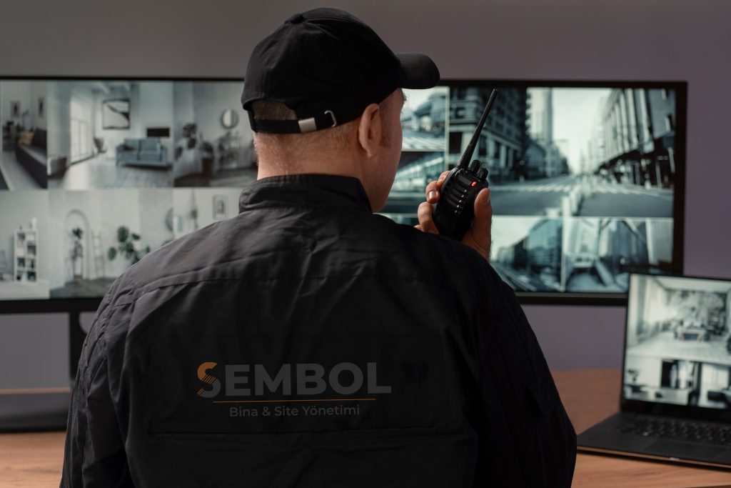 portrait-male-security-guard-with-radio-station-camera-screens2